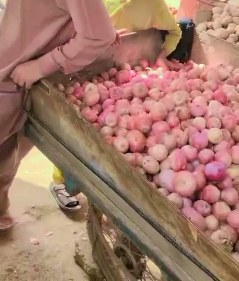 A cart of onions ready for customers